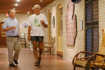 senior man walking the hallway