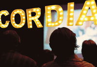 Members of Cordia's Film Club watch a movie in Cordia's theater.