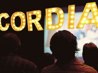 Members of Cordia's Film Club watch a movie in Cordia's theater.